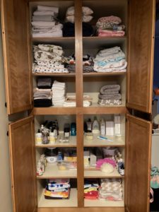 tidy linens and bathroom overflow storage